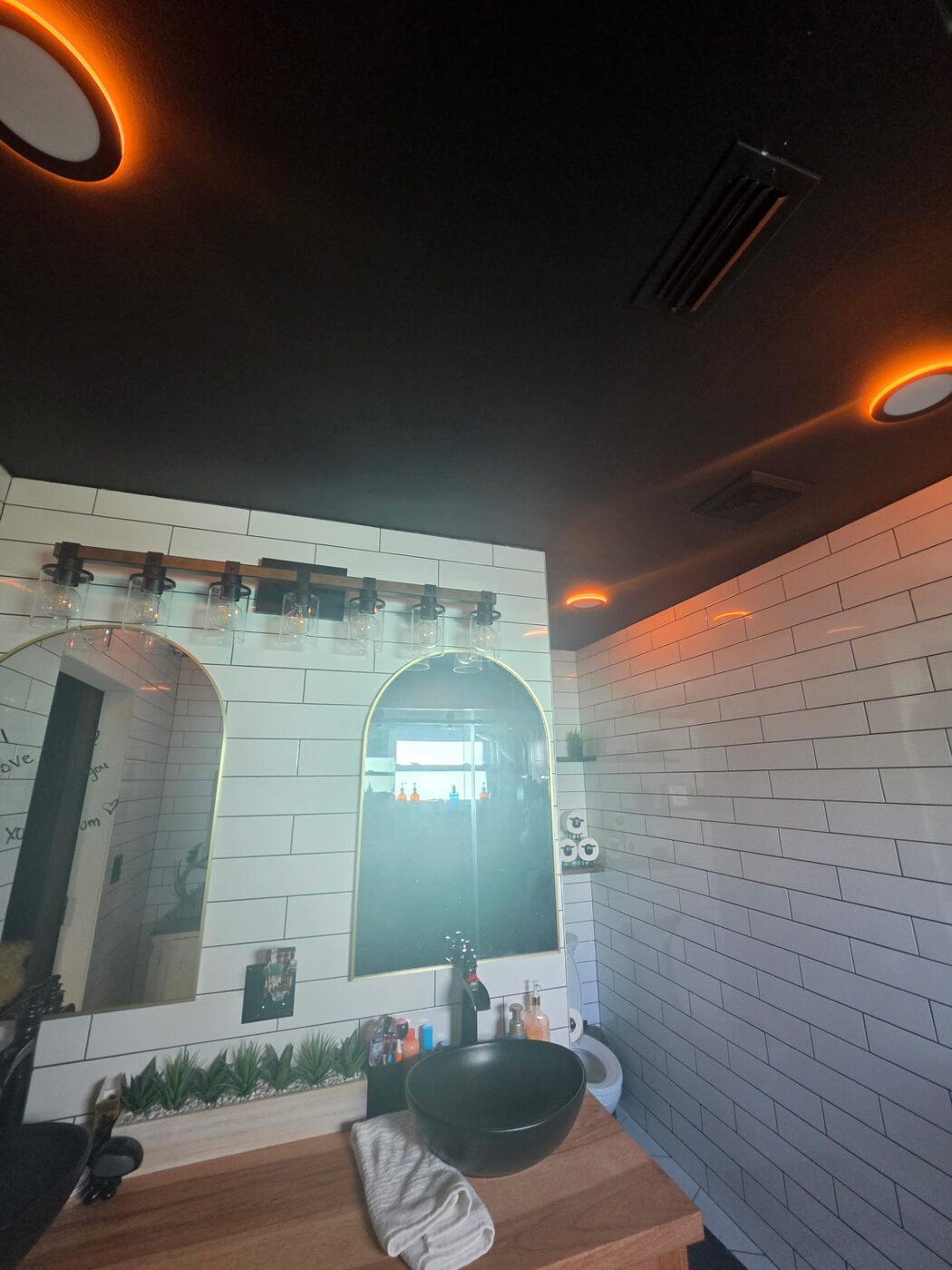 Bathroom ceiling lights set to a warm amber accent color