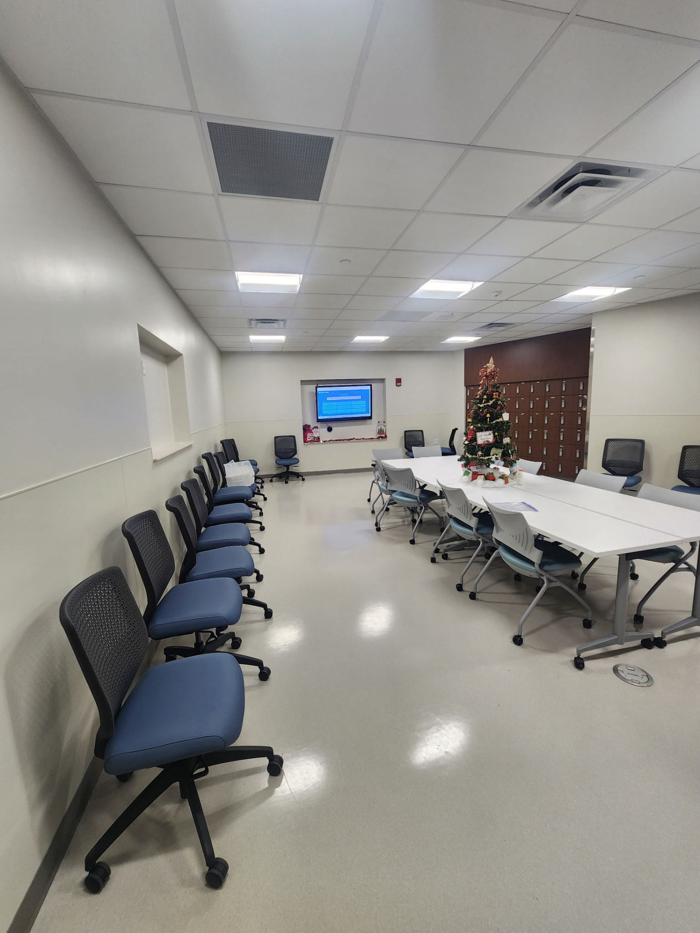 Conference and training room with LED panel lighting and display