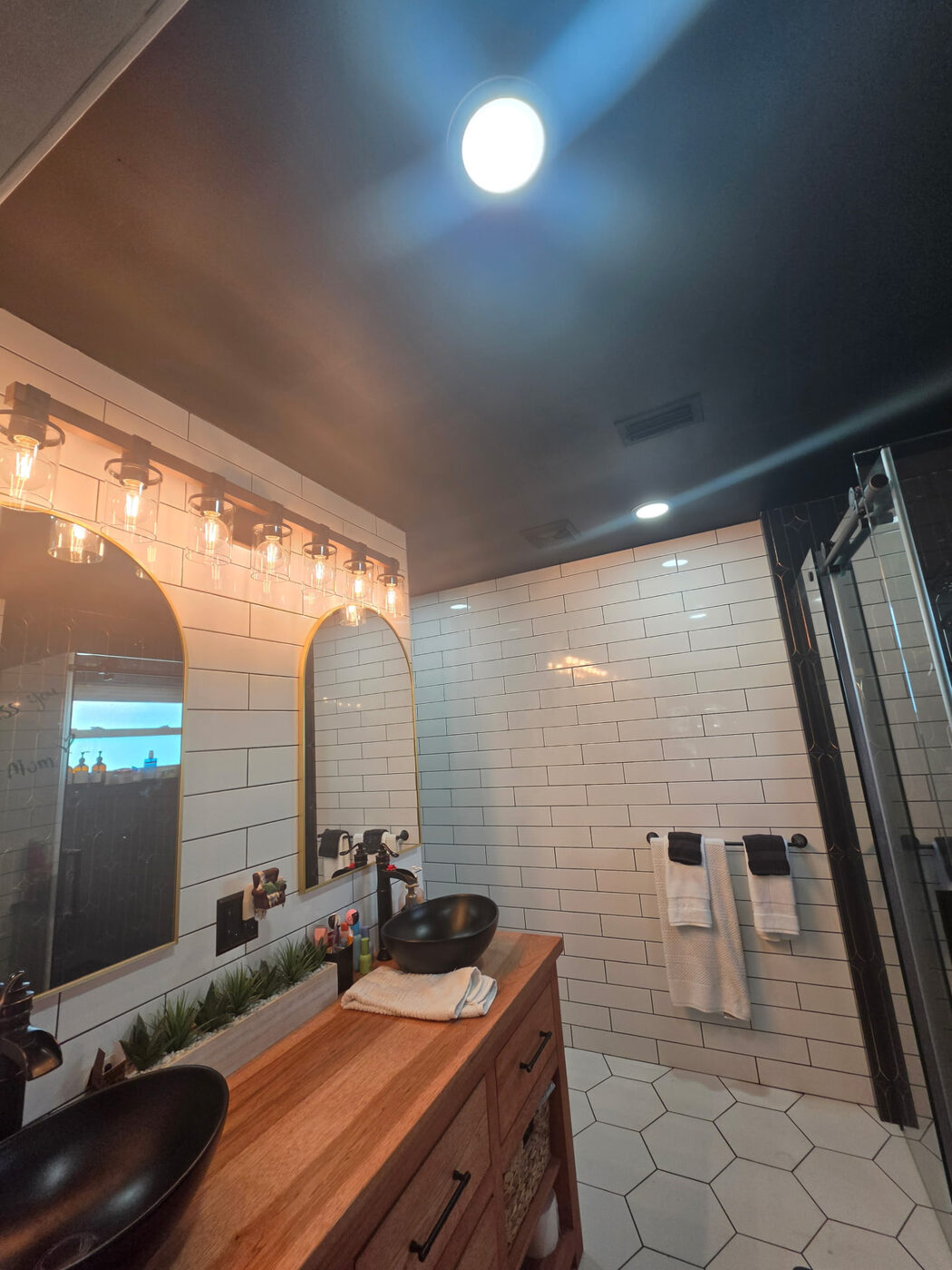 Bathroom with bright white LED ceiling lighting and vanity bar