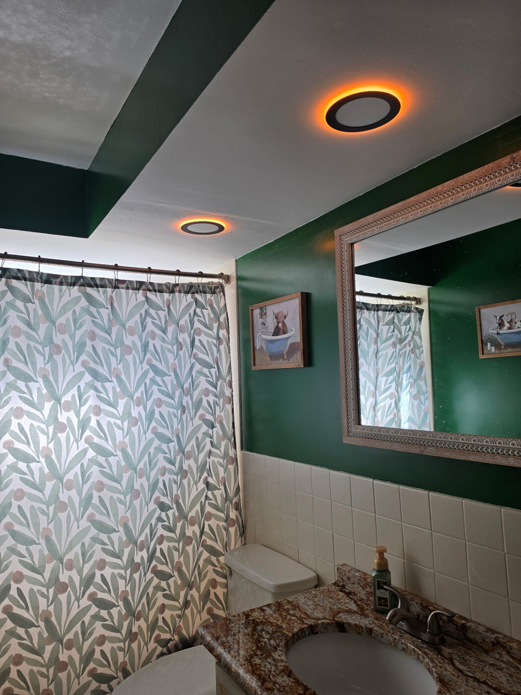 Guest bathroom with amber accent ring lighting on the ceiling