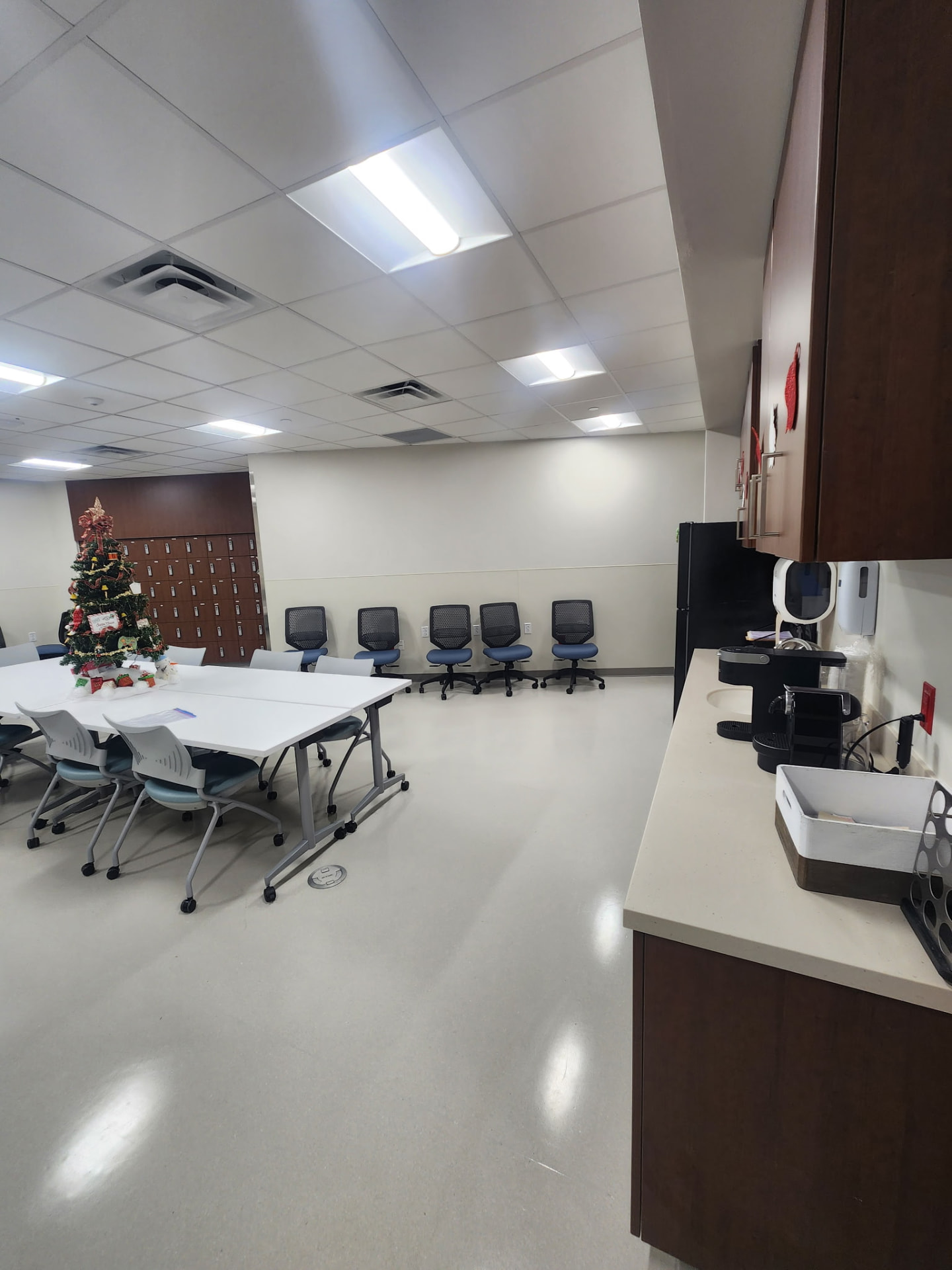 Commercial break room with new recessed troffer lighting overhead